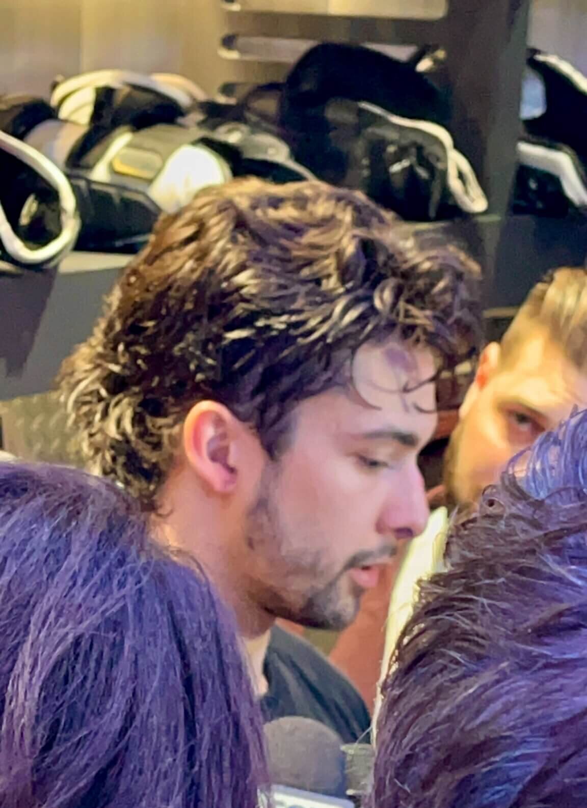 Utah Mammoth Dylan Guenther speaking to reporters in the Deltal Center locker room after scoring in the first period of the first Game the Team had ever hosted in the Stanley Cup Playoffs.