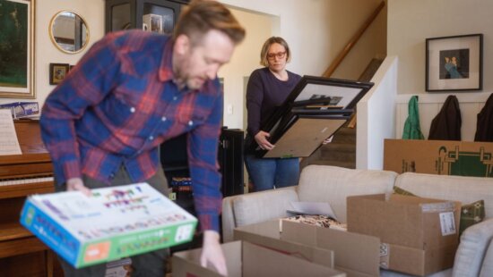 Jared and Adrienne Cardon pack moving boxes at their home in Orem on Saturday, Feb. 28, 2026.