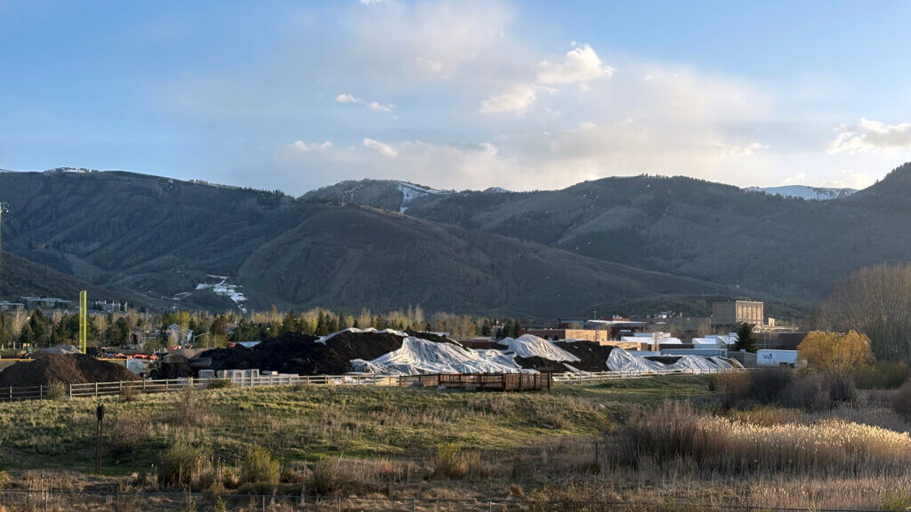 The piles of contaminated soil photographed April 20, 2026 at 7:35 p.m.