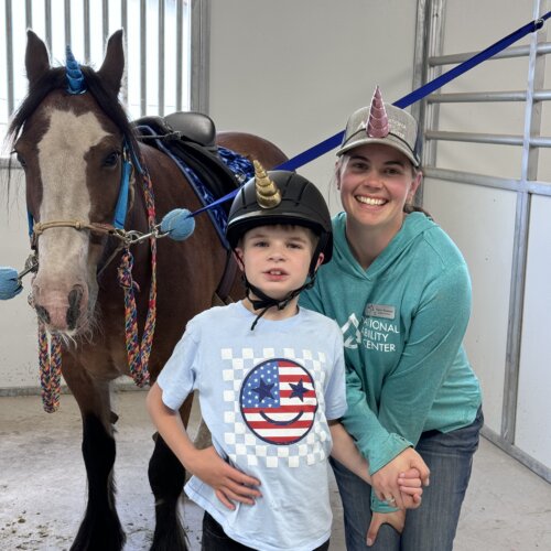 Unicorns du-jour, Rhett Olsen and one of his instructors inside the NAC Barn.