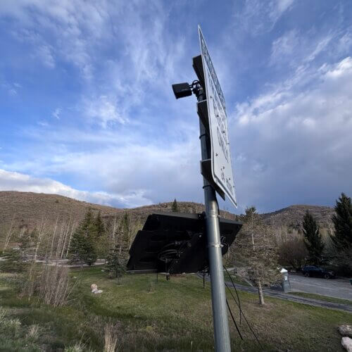 A Motorola license plate reader on State Route 248, one of the main routes connecting Park City to Quinn's Junction and U.S. Highway 40. The small camera unit is mounted on the back of a road sign pole near Prospector Park.