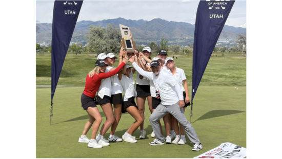 Hoisting the trophy for the first time is the Miners girls Golf Team at the Utah High School Championships.