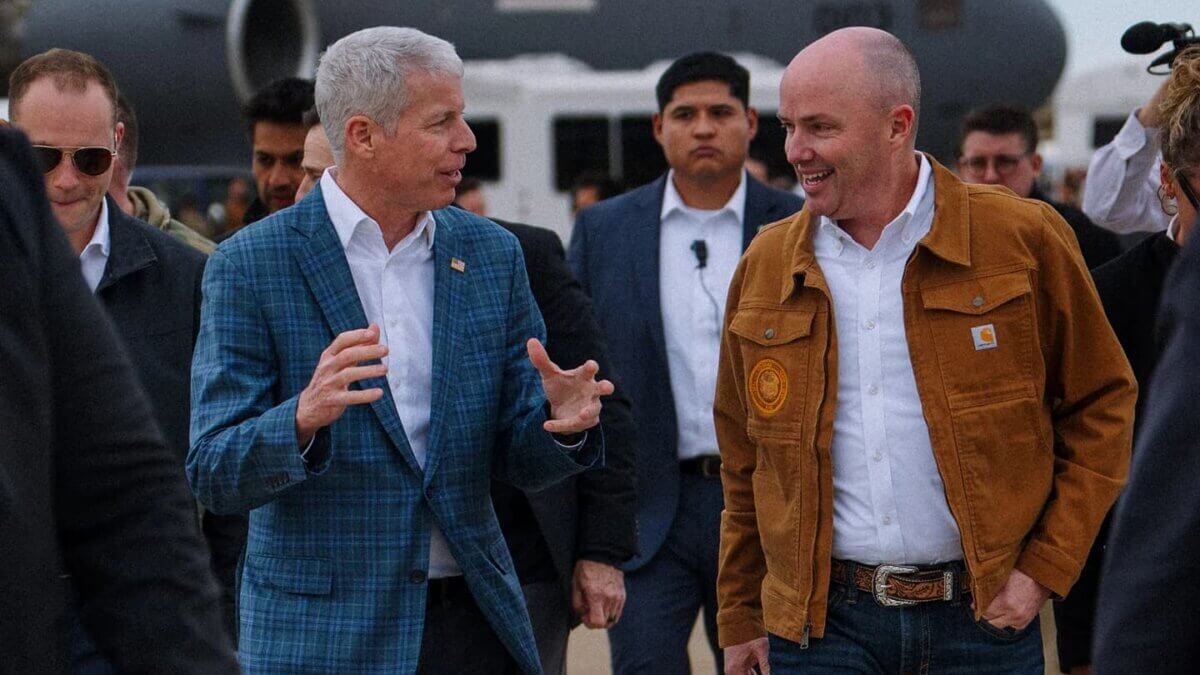 Gov. Spencer Cox, right, on the tarmac in front of a U.S. Air Force C-17 will host the Operation Gigawatt Summit Friday at the Grand Hyatt Deer Valley.