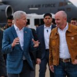 Gov. Spencer Cox, right, on the tarmac in front of a U.S. Air Force C-17 will host the Operation Gigawatt Summit Friday at the Grand Hyatt Deer Valley.
