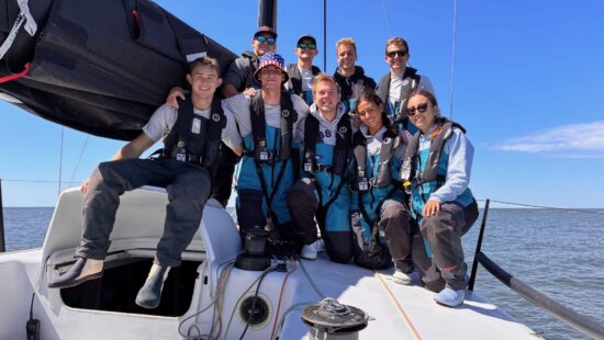Calvin Marsh (left) and his sailboat crew.