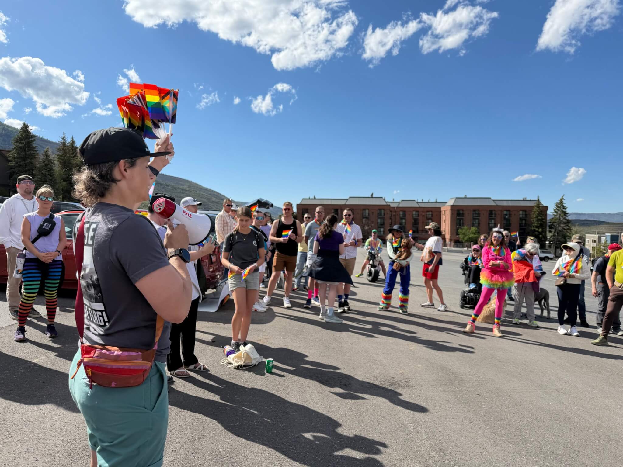 Virginia Solomon, President of Summit Pride Foundation, addresses the crowd before Summit Pride Foundation’s Park City Pride march from Park City Mountain Resort to City Park on Sunday, May 31.