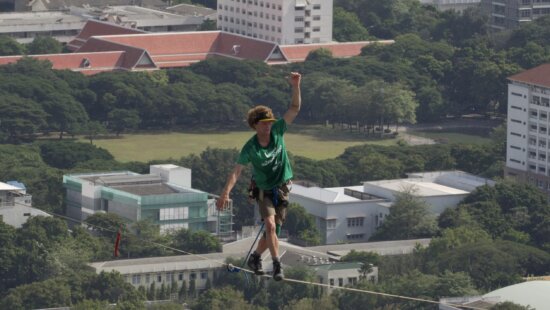 U.S. slackliner Andy Lewis of Calif. balances on a slackline in Bangkok, Thailand, July 23, 2014.