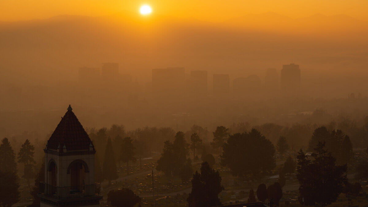 Air thick with particulate pollution and fog hangs over Salt Lake City on Friday, Dec. 6, 2024. The AQI at the time was listed at 130 according to AirNow.gov, and the National Weather Service had issued a dense fog advisory.