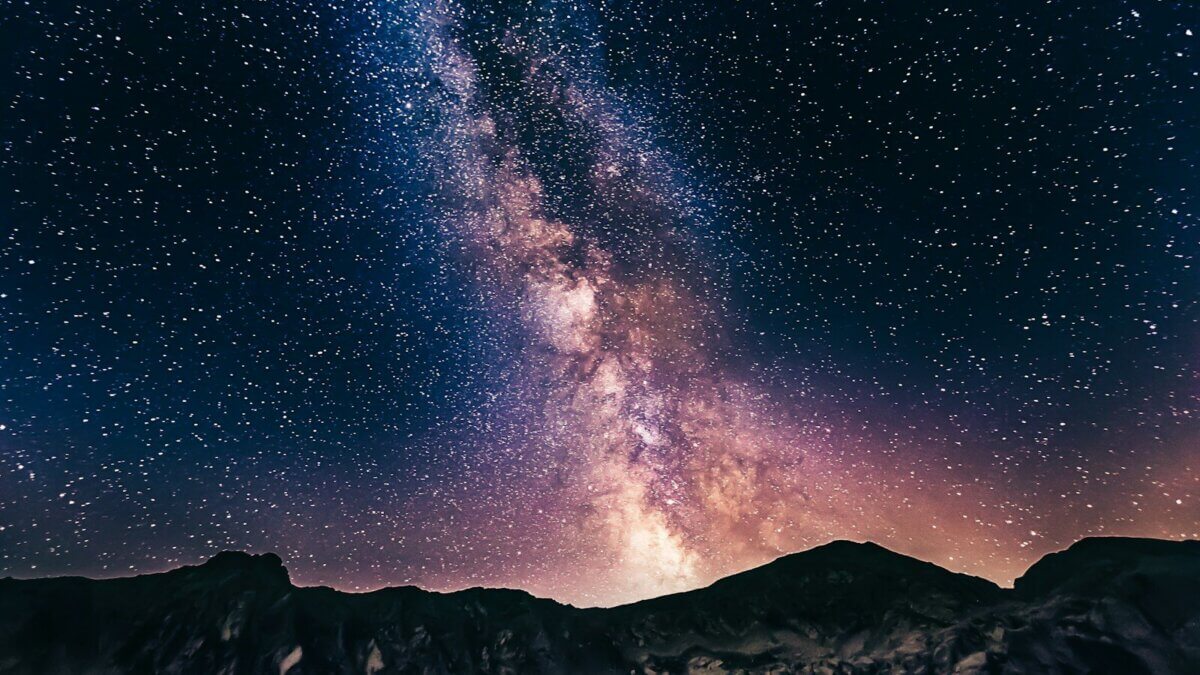 The Milky Way stretches across a dark summer sky. The nights surrounding the July 14 new moon offer some of the month’s best conditions for viewing the galaxy with the naked eye, according to NASA.