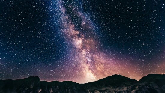 The Milky Way stretches across a dark summer sky. The nights surrounding the July 14 new moon offer some of the month’s best conditions for viewing the galaxy with the naked eye, according to NASA.