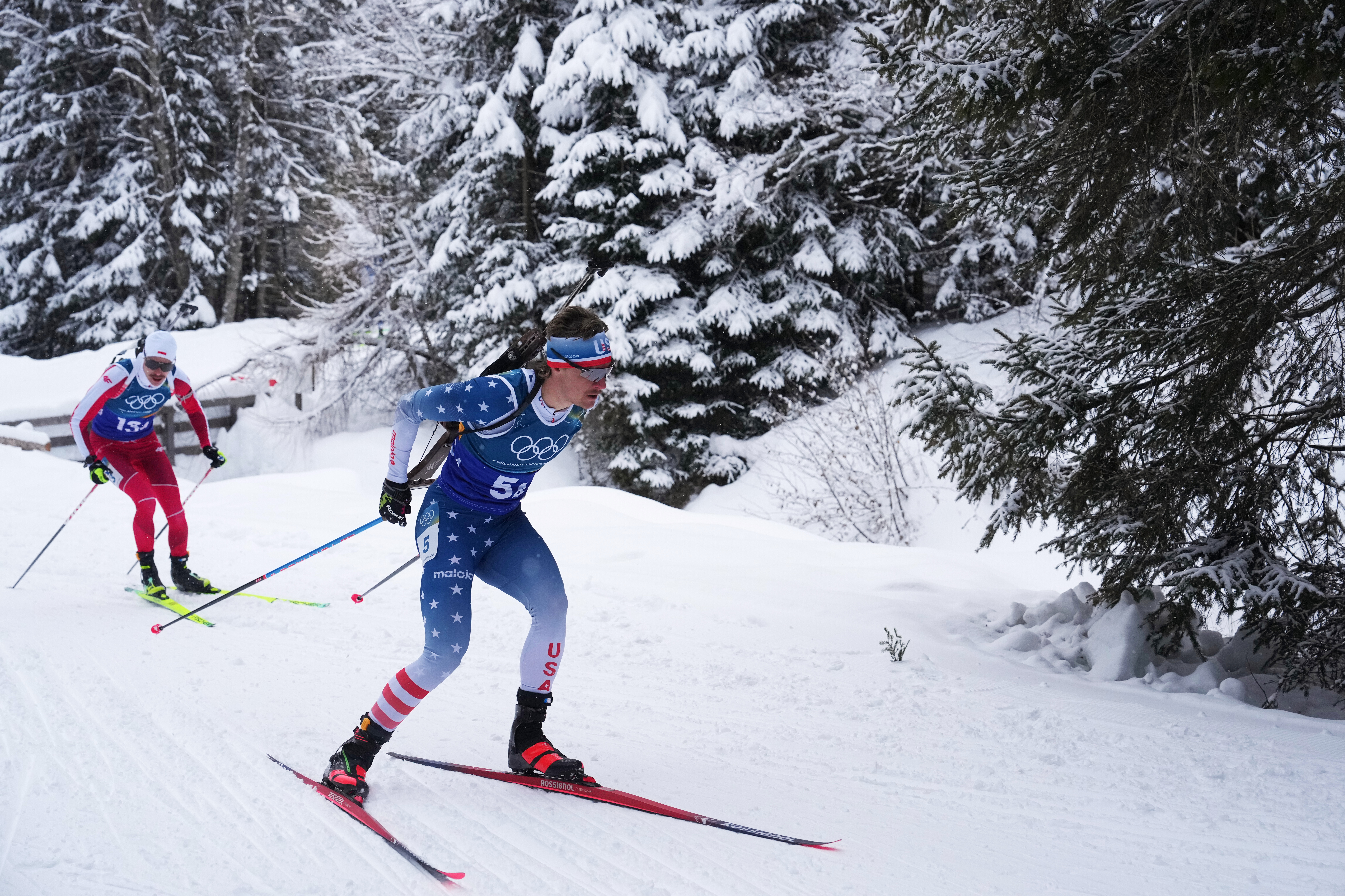 Campbell Wright, of the United States, right, competes in the men's 4x7.5-kilometer relay biathlon race at the 2026 Winter Olympics in Anterselva, Italy, Feb. 17, 2026.