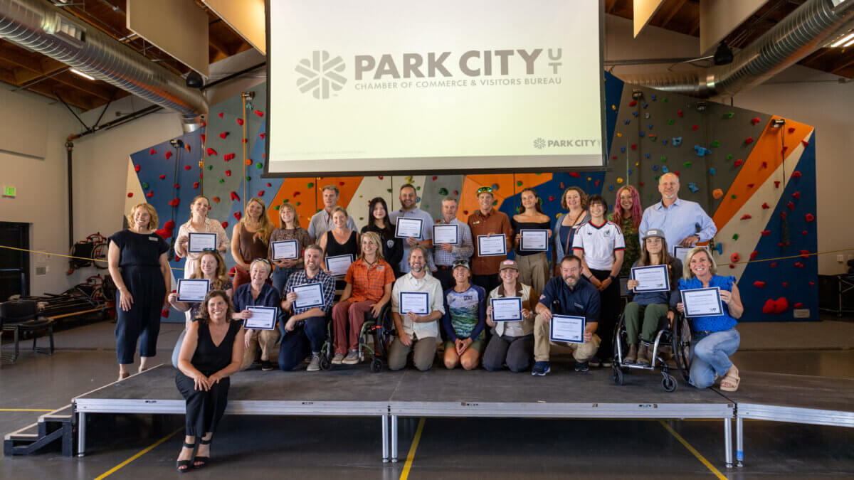 Representatives from Park City businesses and community organizations celebrate earning Wheel the World’s Accessibility Verified designation during a July 23 event at the National Ability Center. Thirty local businesses were recognized for providing verified accessibility information and accommodations for travelers with disabilities.