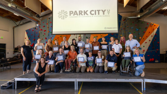 Representatives from Park City businesses and community organizations celebrate earning Wheel the World’s Accessibility Verified designation during a July 23 event at the National Ability Center. Thirty local businesses were recognized for providing verified accessibility information and accommodations for travelers with disabilities.