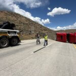 A semi rollover crash is blocking all lanes on WB I-80 east of Park City.