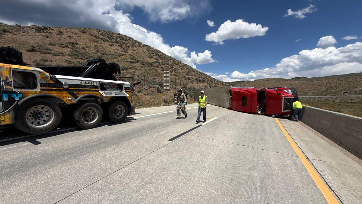 A semi rollover crash is blocking all lanes on WB I-80 east of Park City.