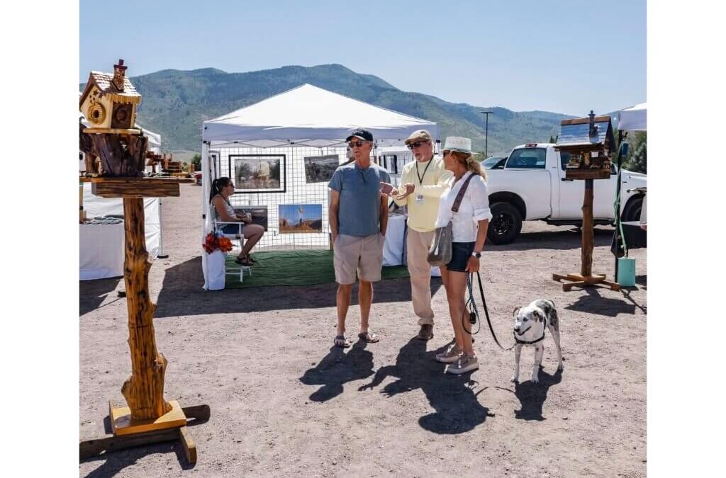 Visitors browse work from local artists during a previous Summit Arts Market at the Red Barn in Oakley. The free annual event returns Saturday, July 11.