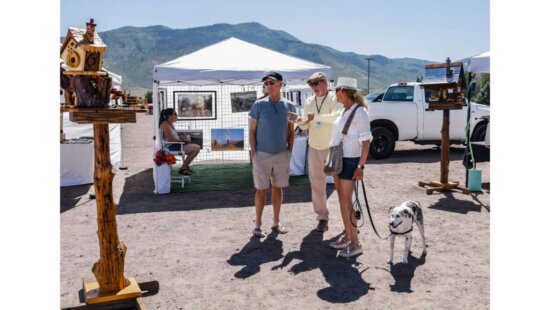 Visitors browse work from local artists during a previous Summit Arts Market at the Red Barn in Oakley. The free annual event returns Saturday, July 11.