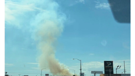 Smoke rises from the Adams Fire near Washington Terrace in Weber County as firefighters respond to the growing wildfire.