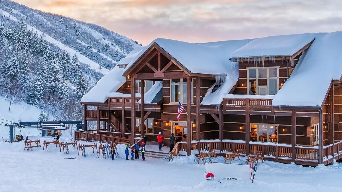 Cherry Peak Resort’s lodge sits beneath snow-covered mountains near Richmond in northern Utah. The family-owned ski area has been listed for sale for $22.5 million.