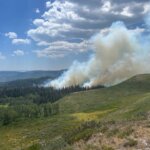 Smoke rises from the Buck Basin Fire burning in patches of timber northwest of Currant Creek Reservoir on the Heber-Kamas Ranger District on Sunday, July 12, 2026. The lightning-caused fire is estimated at 30 acres.