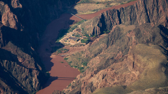 Bright Angel Canyon, the scene of flash floods, center right, merges with the Colorado River in the Grand Canyon, Monday, Aug. 31, 2026, at Grand Canyon National Park, Ariz.