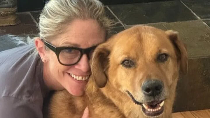 Journalist Michelle Deininger is pictured with her dog.