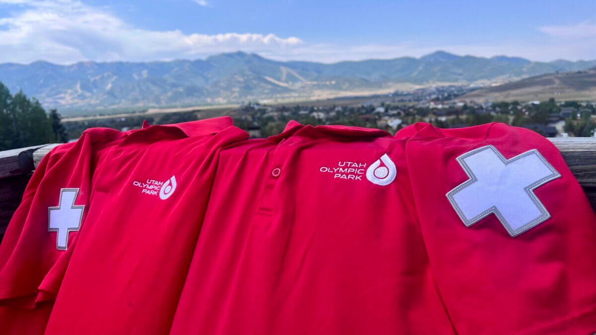 Utah Olympic Park in the background, Utah Olympic Park Ski Patrol uniforms front and center.