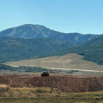 an excavator moves dirt at Richardson Flat on Monday August 3, 2026.