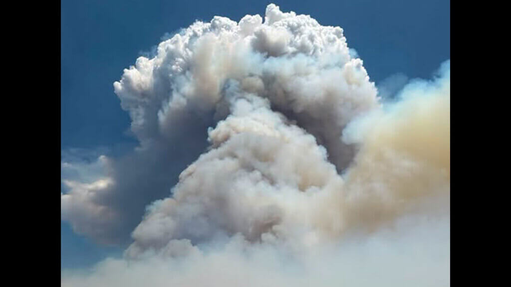 A massive smoke column rises from the Rocky Canyon Fire burning in the East Canyon area