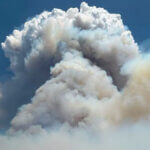 A massive smoke column rises from the Rocky Canyon Fire burning in the East Canyon area