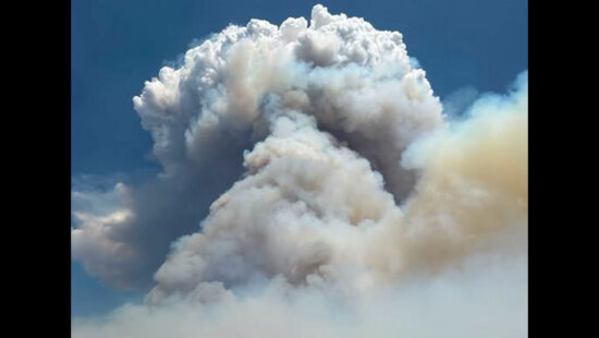 A massive smoke column rises from the Rocky Canyon Fire burning in the East Canyon area