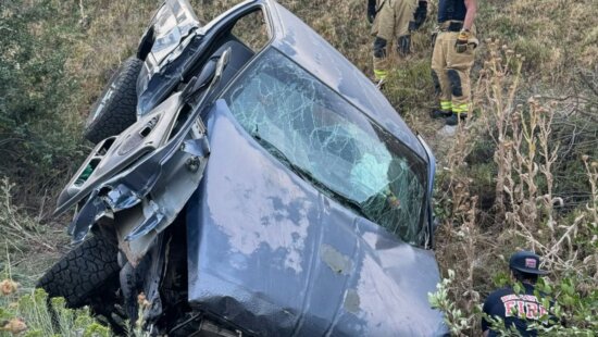 A vehicle rolled off the highway after a crash on US-189.