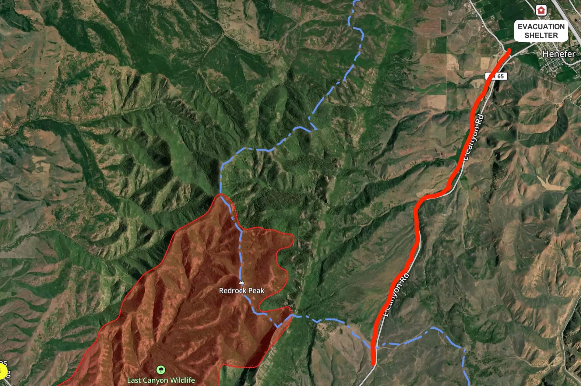 A map shows the West Henefer evacuation zone, highlighted in red, stretching from Hog Back Summit to West Henefer Road south of Henefer. All residences in the area are in "Go" status and have been ordered to evacuate as the Rocky Canyon Fire, shown at left, expands northeast.