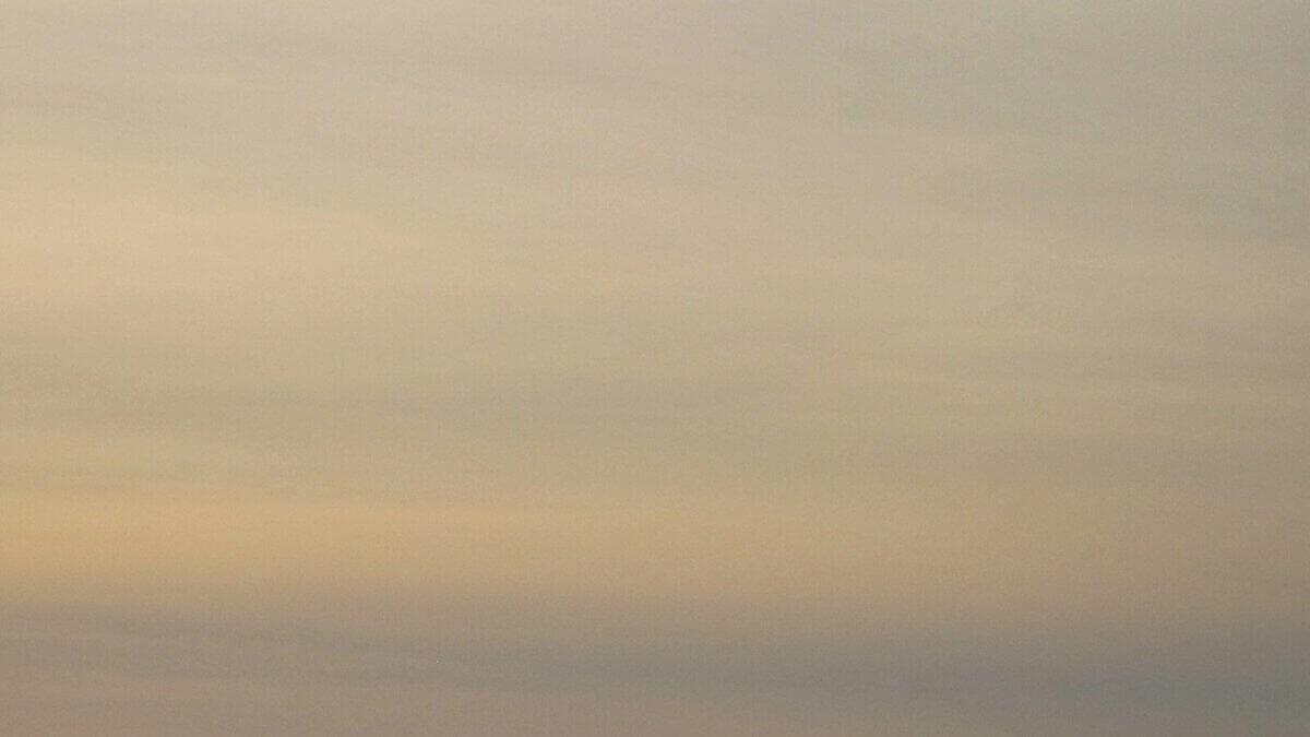 Hazy skies settle over northern Utah as wildfire smoke drifts into the region and temperatures rise.