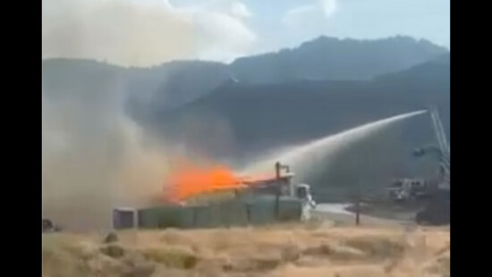 Fire crews battle a blaze at a home under construction in the SkyRidge community Friday.