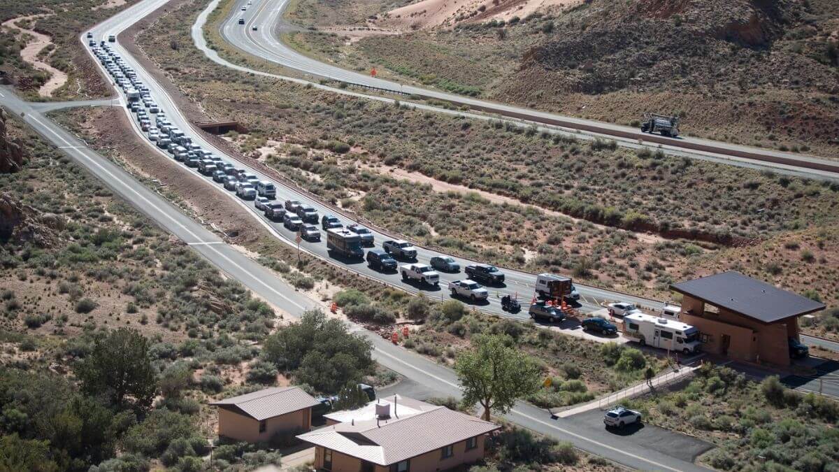 Lengthy entrance lines are common at Arches National Park during busy seasons.