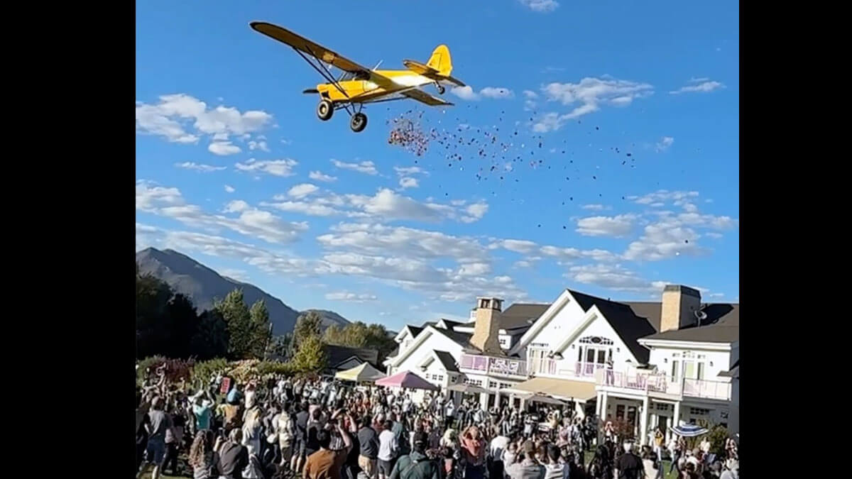Candy rains down on the crowd at Summerhouse Farms as a low-flying plane makes its pass during the Lynden Legacy Pumpkin Patch on Friday, Sept. 25.