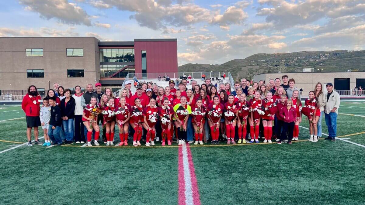 The players, parents, siblings, grandparents, and guardians of the PCHS Soccer Team gathered for Senior Night. Head Coach Anthony Dicicco is on the far left.