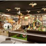 The design of Treehouse Park City is meant to evoke a woodland setting rather than the brightly lit, high-stimulation feel of many indoor playgrounds.