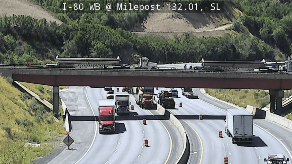 Crews work to fix a large pothole under the center median on I-80 through Parleys Canyon.