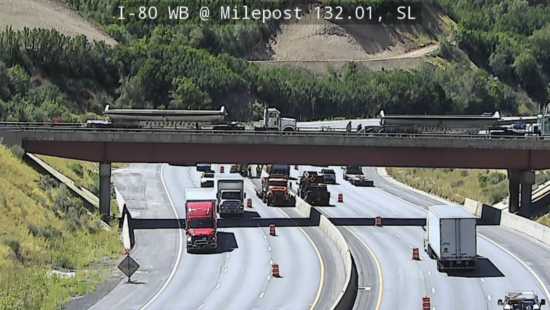 Crews work to fix a large pothole under the center median on I-80 through Parleys Canyon.