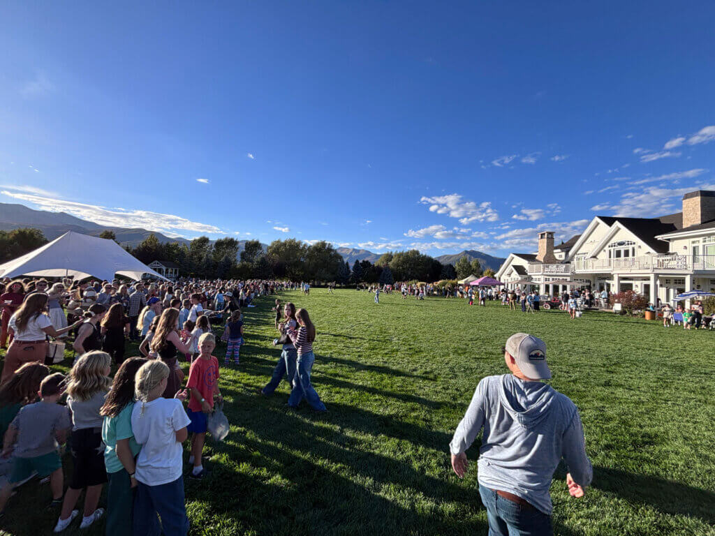 Hundreds of festival goers line the lawn at Summerhouse Farms in Heber City ahead of the candy drop during the Lynden Legacy Pumpkin Patch on Friday, Sept. 25.