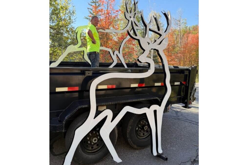 Two reflective deer silhouettes donated by Save People Save Wildlife are transported by Hideout Public Works for future placement along SR 248. The Town of Hideout and UDOT will determine where the silhouettes will be installed.