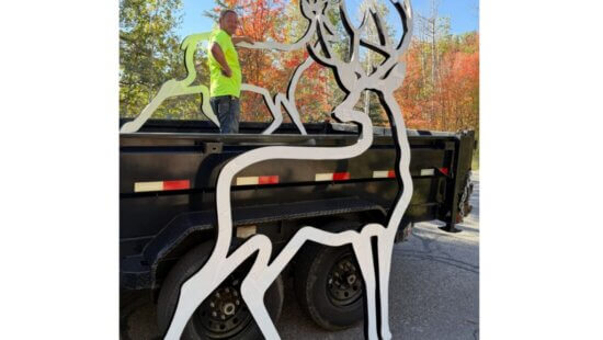 Two reflective deer silhouettes donated by Save People Save Wildlife are transported by Hideout Public Works for future placement along SR 248. The Town of Hideout and UDOT will determine where the silhouettes will be installed.