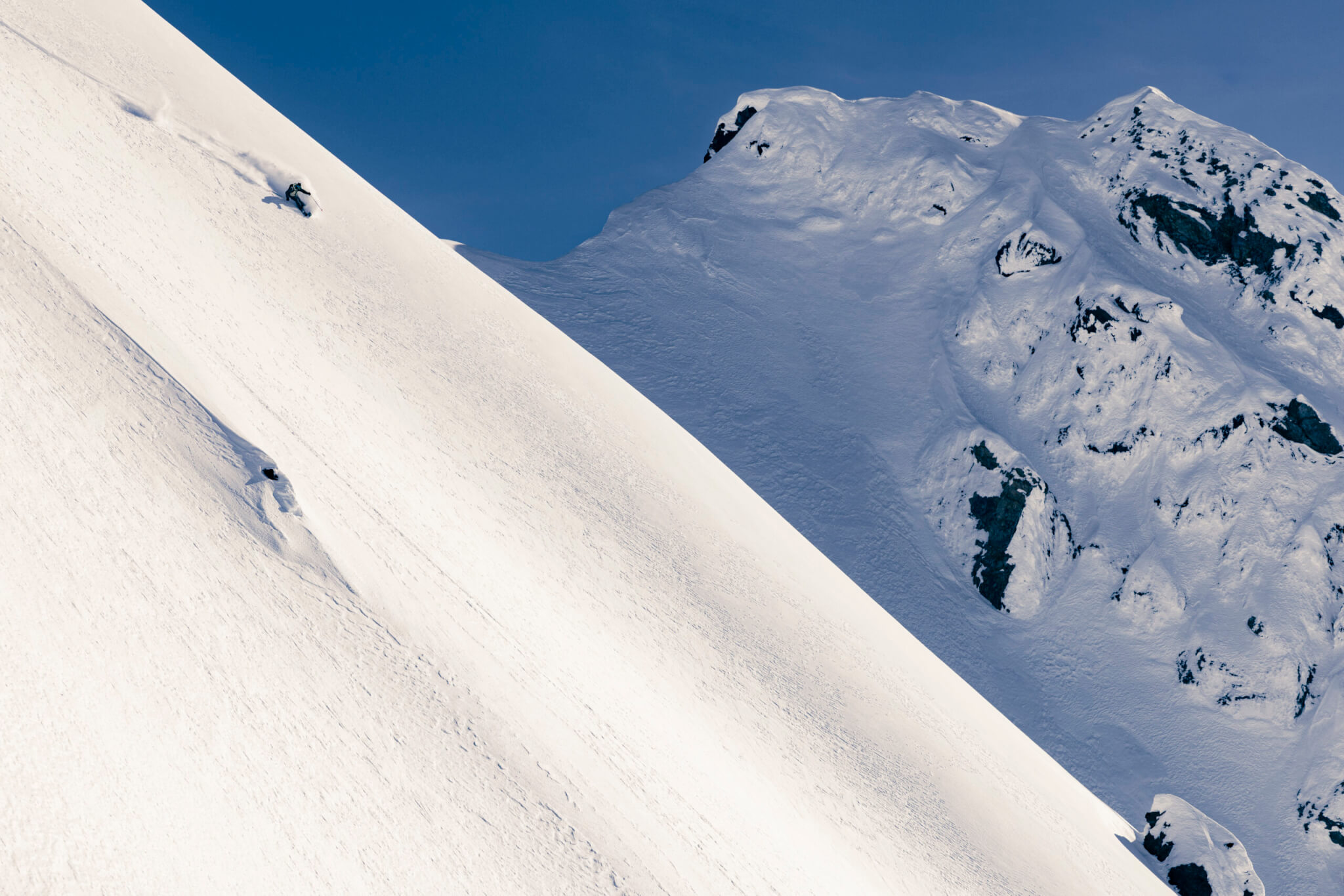 A skier descends a steep, snow-covered line in Bute Inlet, British Columbia, one of the filming locations featured in Teton Gravity Research’s Actually, It Is Rocket Science. The film screens Sept. 23 at the Jim Santy Auditorium in Park City.