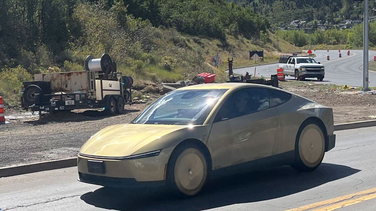 A gold Tesla Cybercab test vehicle travels through the intersection of Bonanza Drive and Deer Valley Drive in Park City on Friday, Sept. 11.