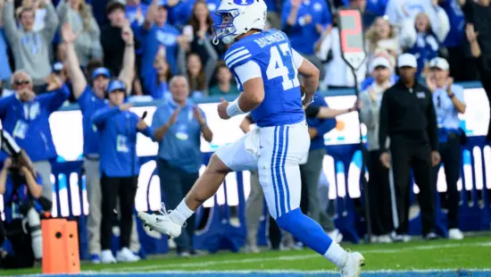 BYU quarterback Bear Bachmeier runs the ball in for a touchdown during the first half of an NCAA college football game against Notre Dame, Saturday, Oct. 17, 2026, in Provo, Utah.