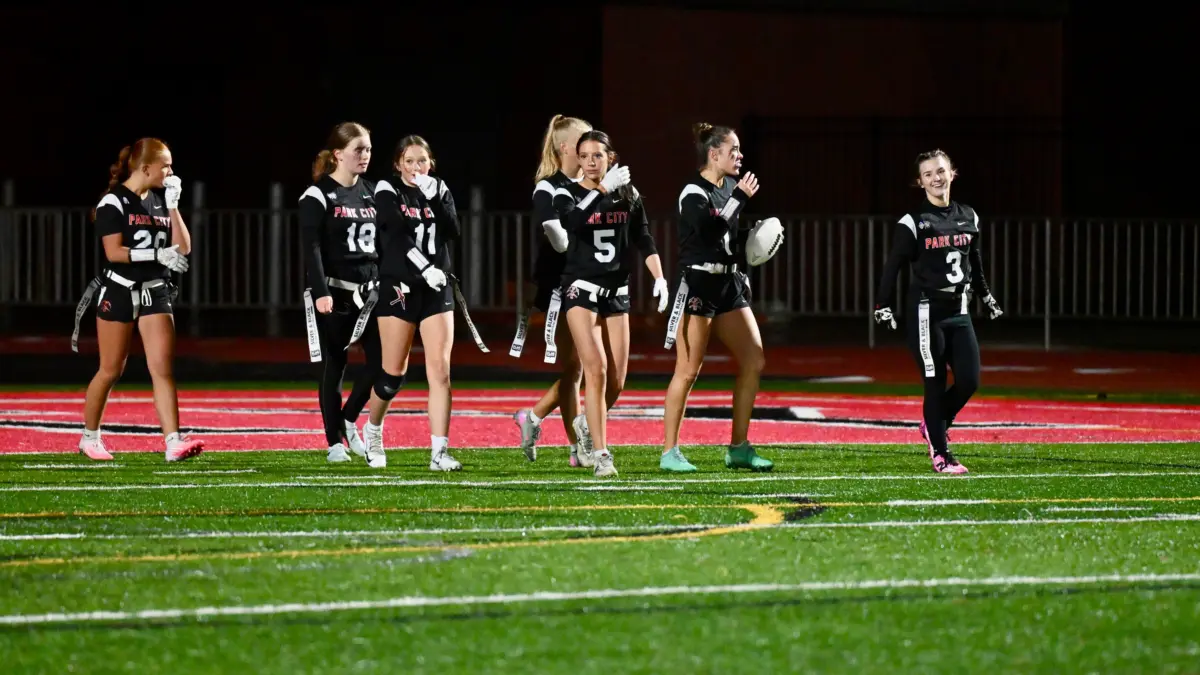 Park City Miners Black flag football team takes the field in the rain Monday evening.