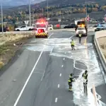 Fire crews work to clean up a paint spill on the ramp from northbound SR 224 to westbound I-80 at Kimball Junction on Thursday evening. The ramp is closed and traffic bound for Salt Lake City is being diverted to the frontage road.