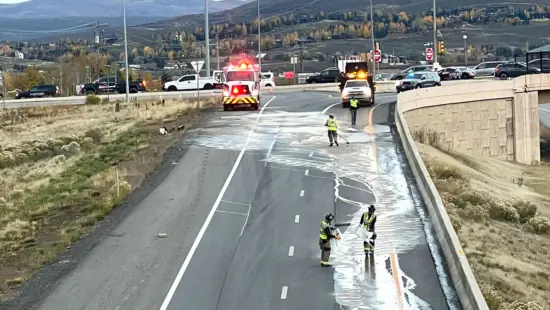 Fire crews work to clean up a paint spill on the ramp from northbound SR 224 to westbound I-80 at Kimball Junction on Thursday evening. The ramp is closed and traffic bound for Salt Lake City is being diverted to the frontage road.
